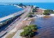 Image of waterway with shoreline and street Image courtesy of Adobe Stock